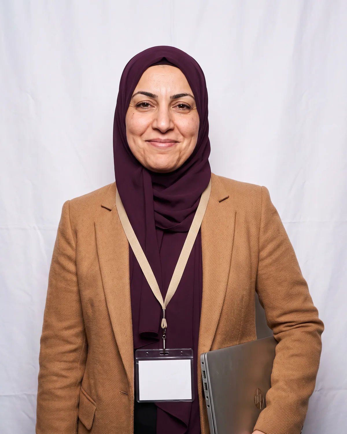 Speaker at a conference with her laptop