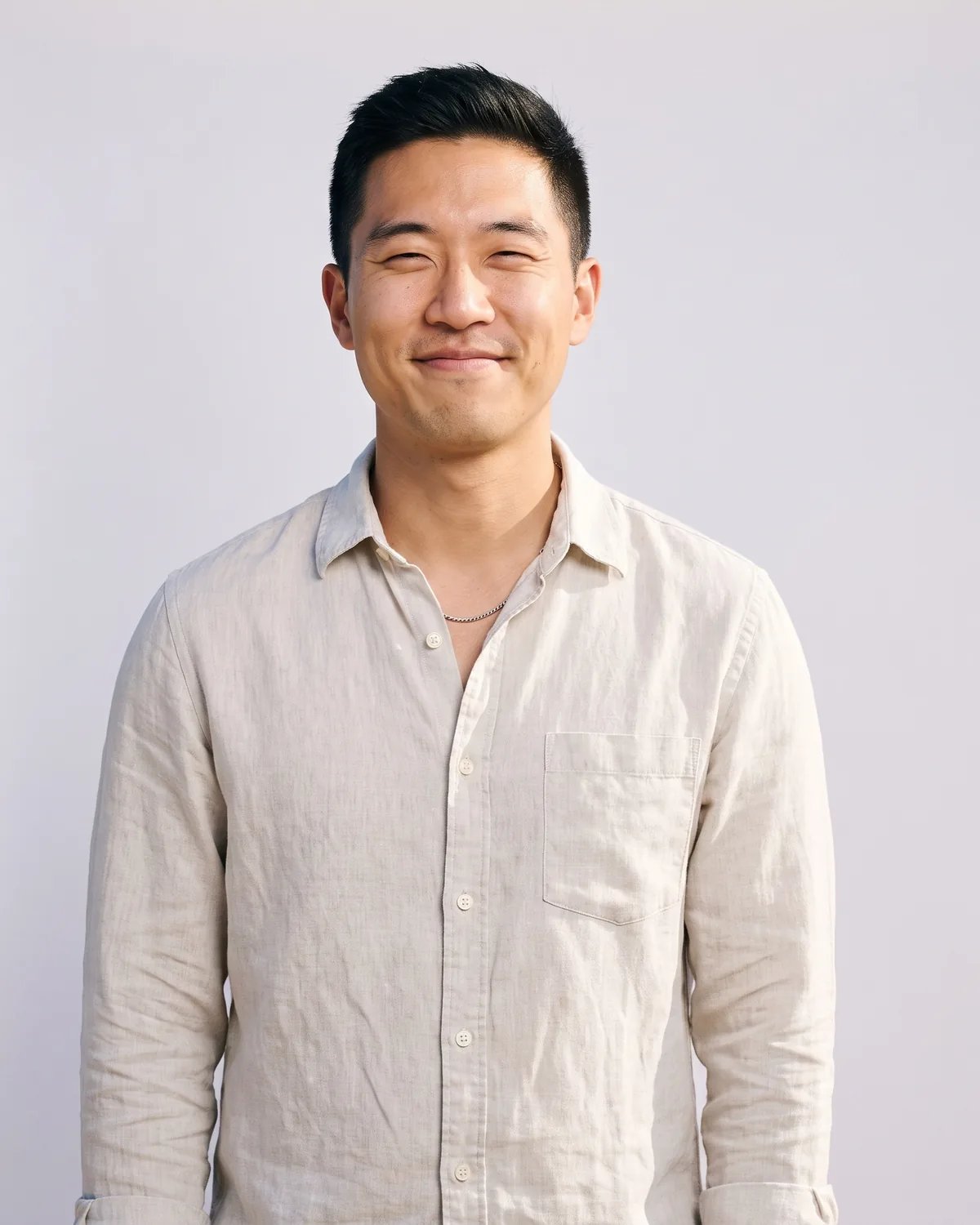 Guest in a linen shirt at a beach activation