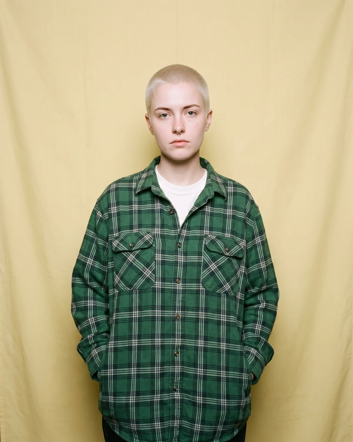 Guest at a store launch party in a green flannel