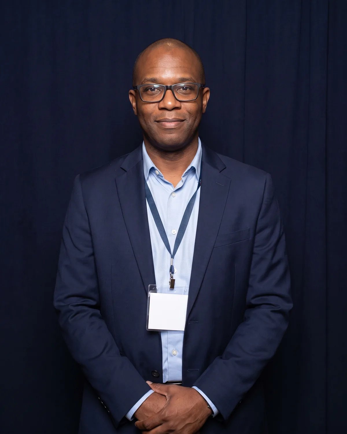 Attendee in a navy blazer at a tech conference