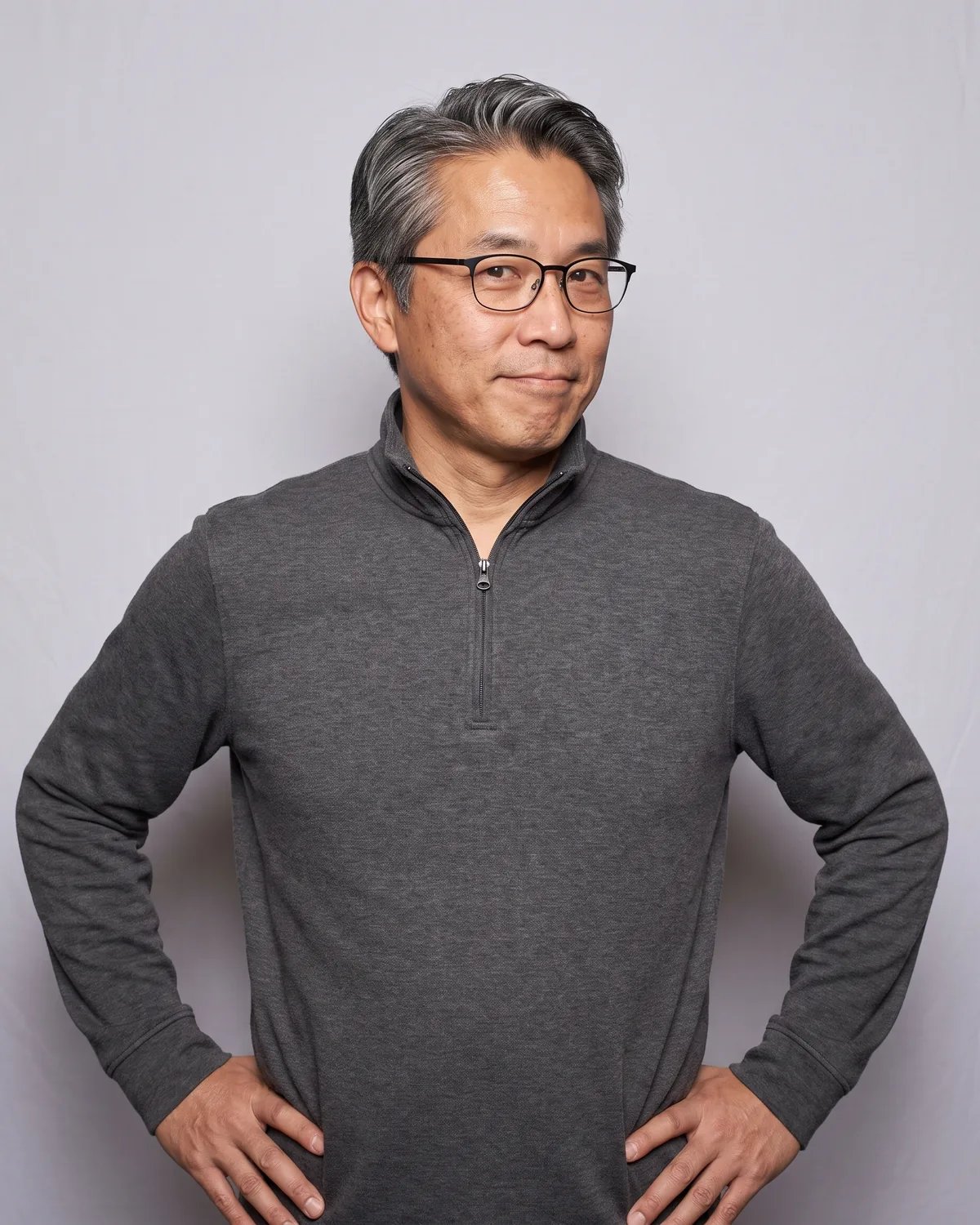 Guest at a corporate offsite with his hands on his hips