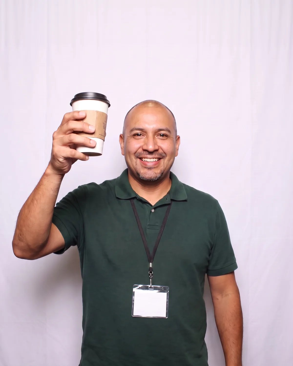 Attendee at a trade show raising his coffee