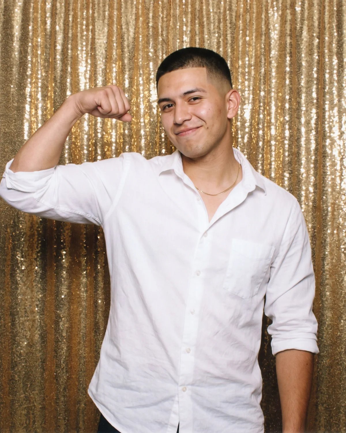 Graduate flexing at his graduation party