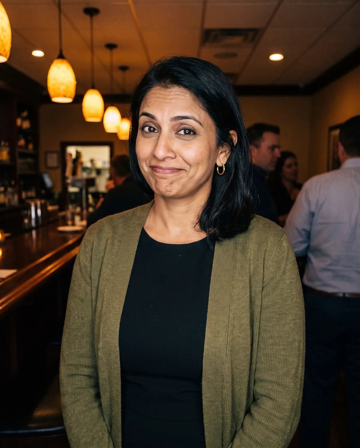 Guest at a 40th birthday dinner with a wry half smile