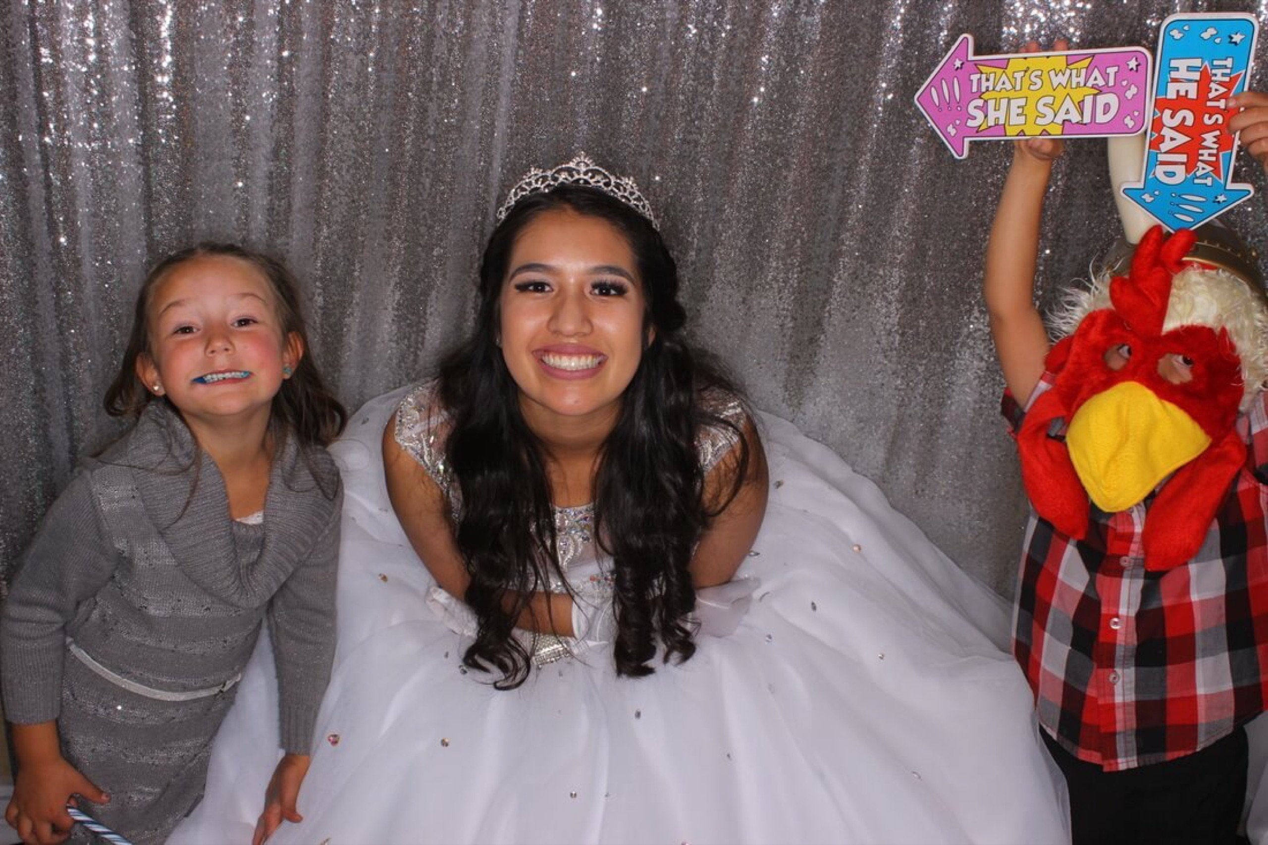Jehnna's quinceañera at El Mezquite, December 9, 2016 — silver sequin backdrop, a tiara, and a little brother in a chicken hat