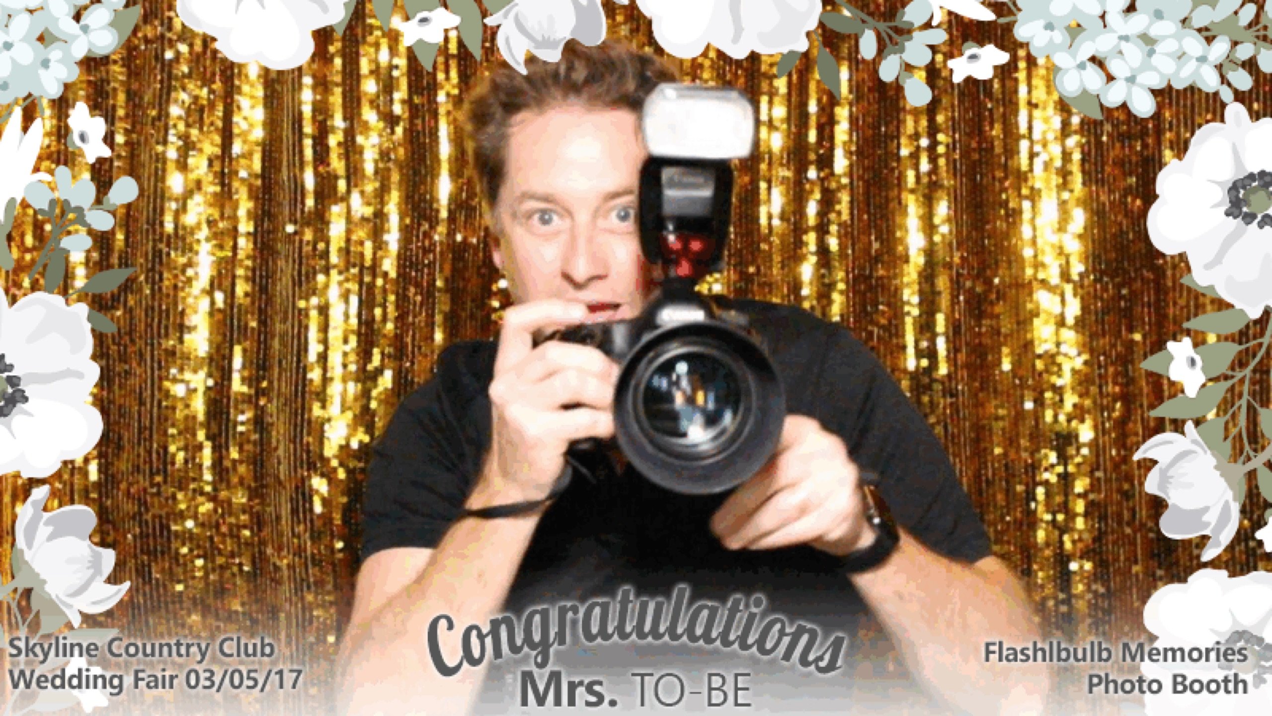 A gold-sequin photo booth print stamped 'Skyline Country Club Wedding Fair 03/05/17 — Congratulations Mrs. To-Be'
