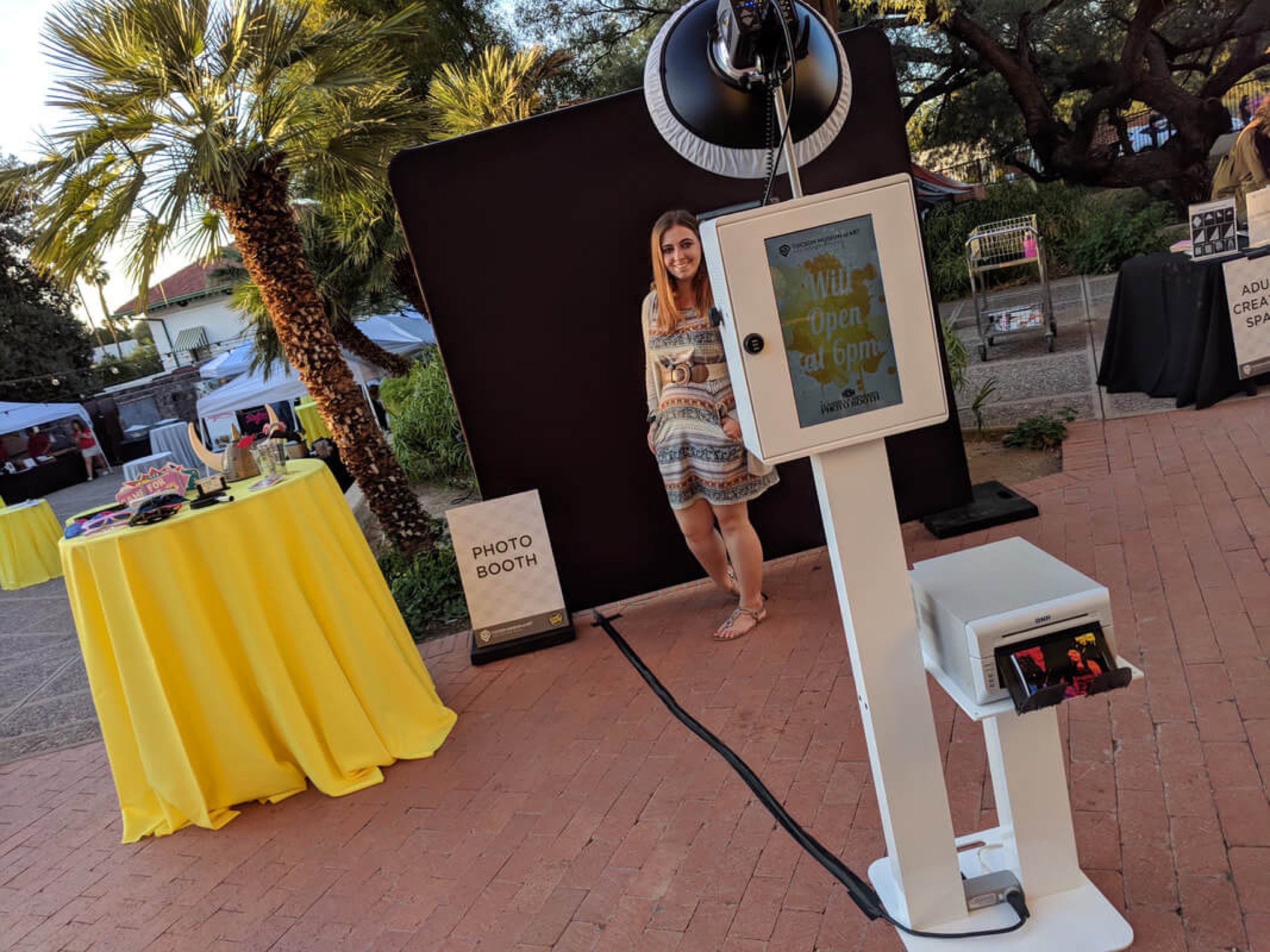 The Tucson Museum of Art Crush Party, November 10, 2017 — a museum-branded welcome screen counting down to the 6 p.m. open, with the props table set up on the plaza
