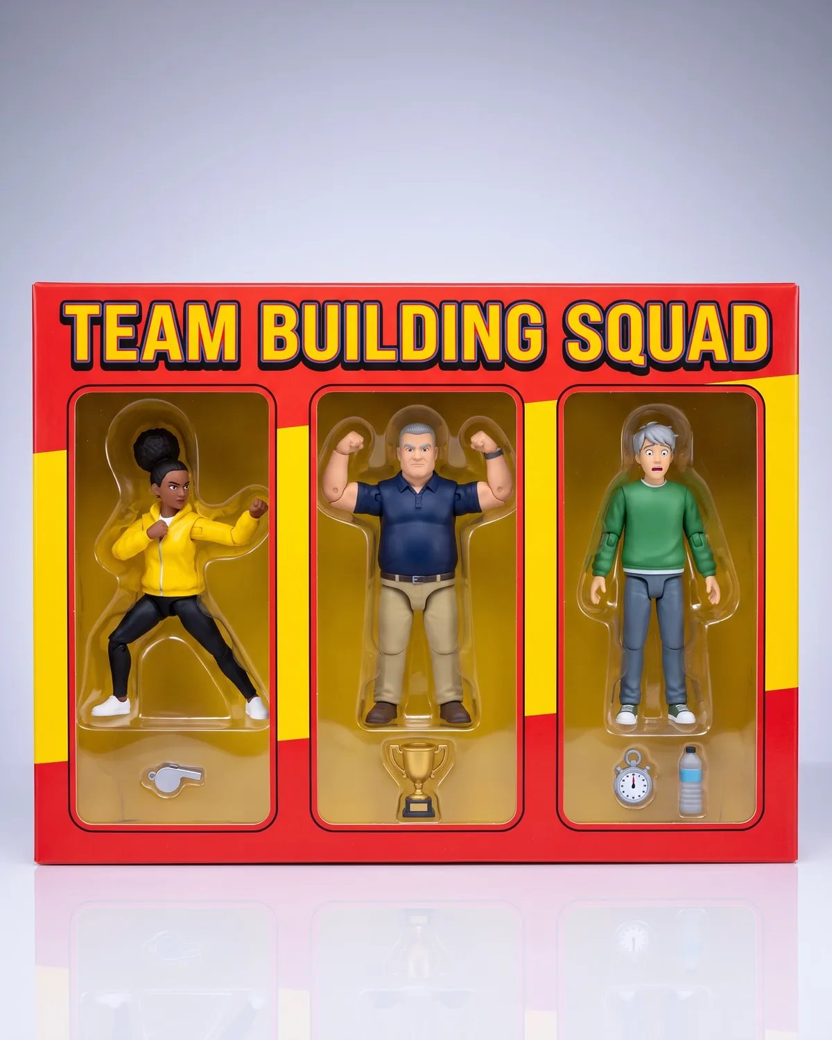The three coworkers as a boxed set of action figures, tiny accessories in slots below them