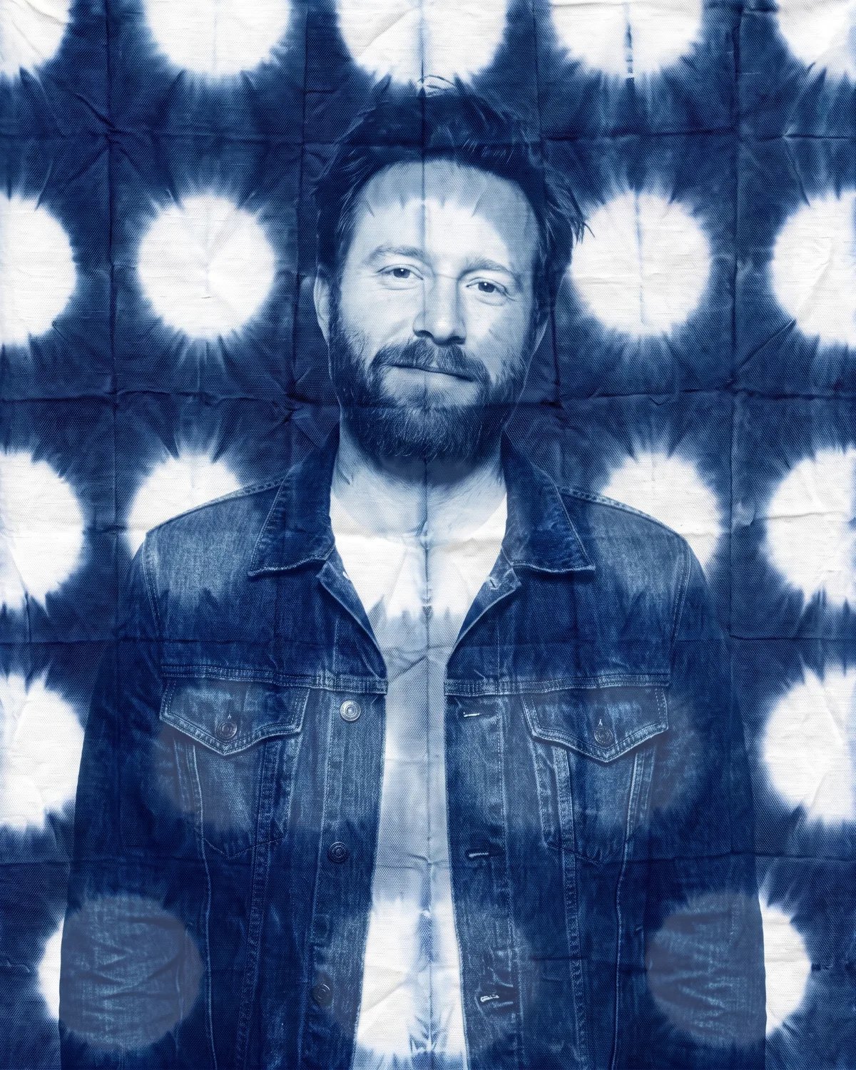 The guest dyed in indigo shibori, his face, beard and jacket included