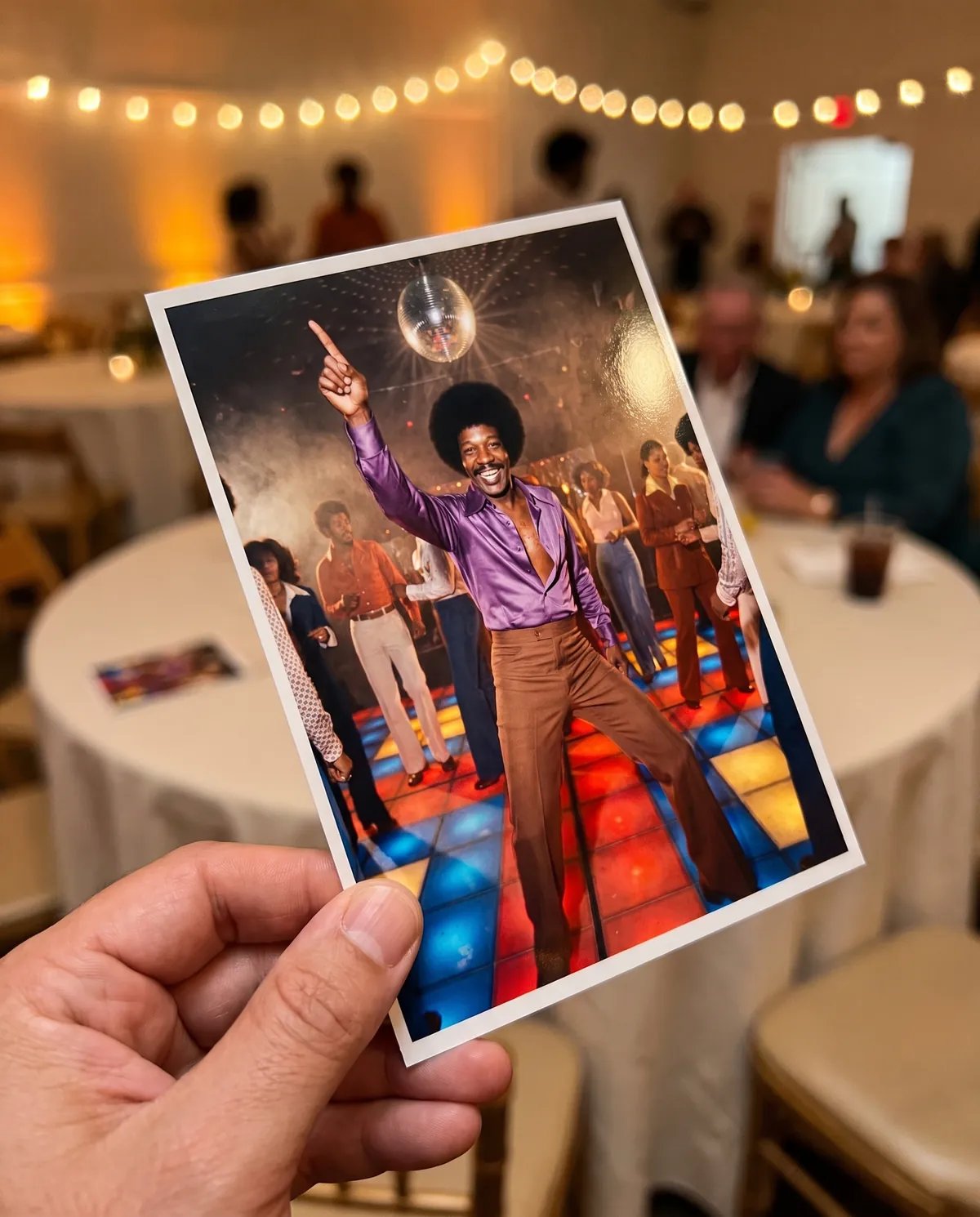 A guest holding a 4x6 print of his 1977 disco result at a retirement party