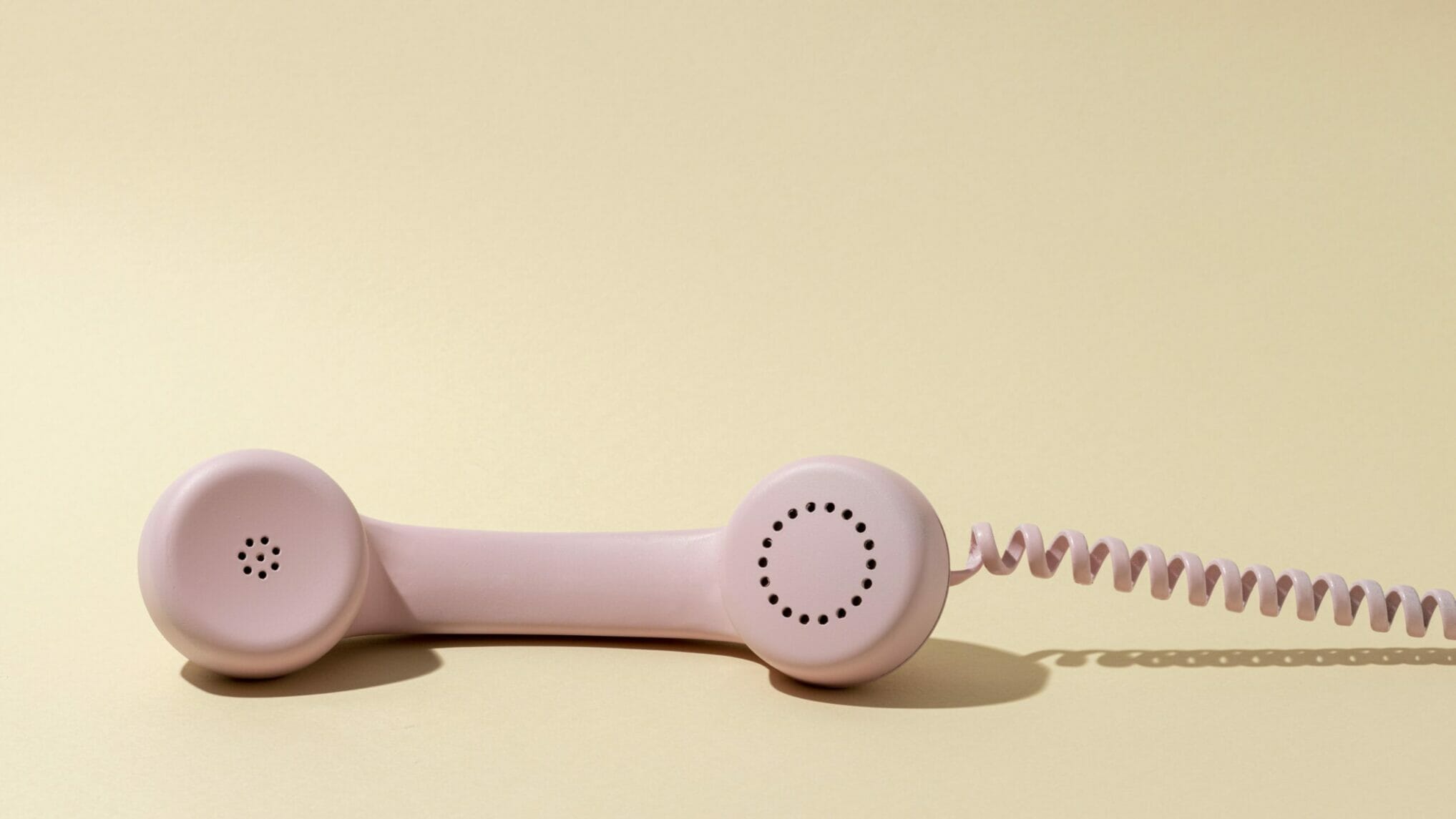 Pink vintage telephone handset used for an audio guest book rental