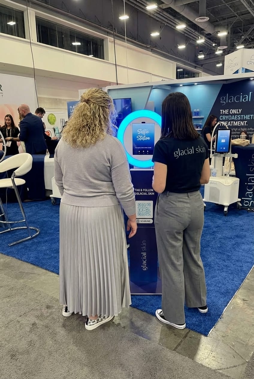 Glacial Skin branded selfie station in use inside the brand's exhibitor booth