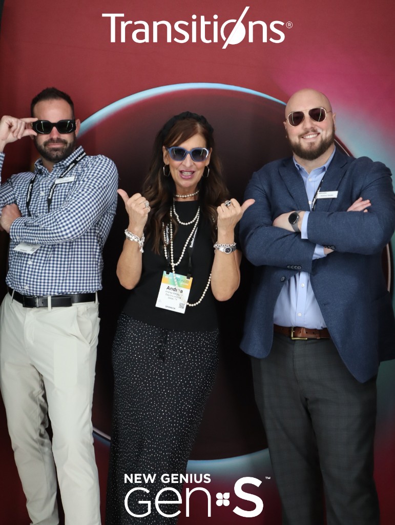 Three guests at a branded corporate backdrop with professional lighting